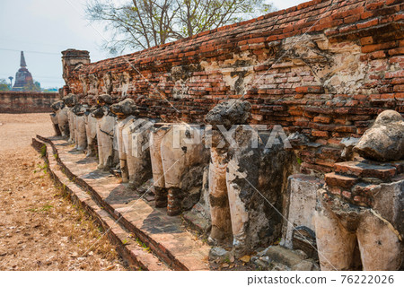 Elephant sculptures at ruins of buddhist temple in Ayutthaya, Thailand Elephant sculptures at ruins of buddhist temple in Ayutthaya, Thailand 76222026