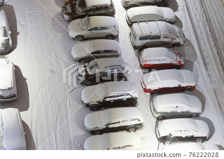 Cars on night winter parking lots Cars on night winter parking lots 76222028