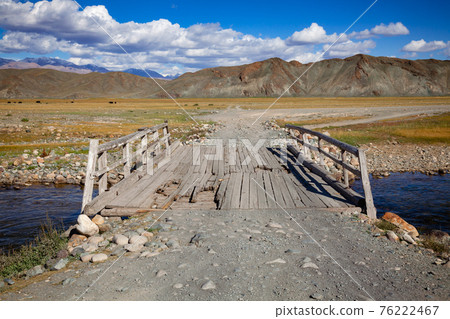 Worn down wooden bridge in Altai Mountains Mongolia 76222467