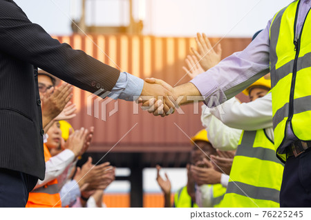 Engineers handshaking on construction site after successful meetingon workers or business Engineers handshaking on construction site after successful meetingon workers or business 76225245