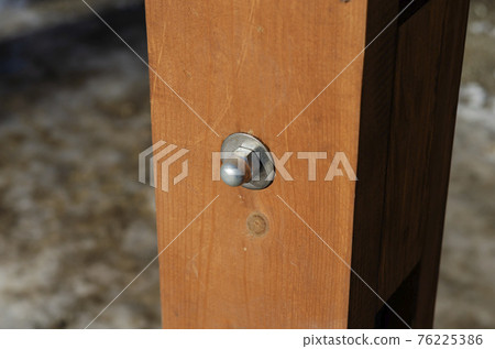 New Bolt and nut are sticking into the wooden bar. 76225386