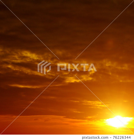 scenic of the strong sunrise and cloud on the orange sky. 76226344