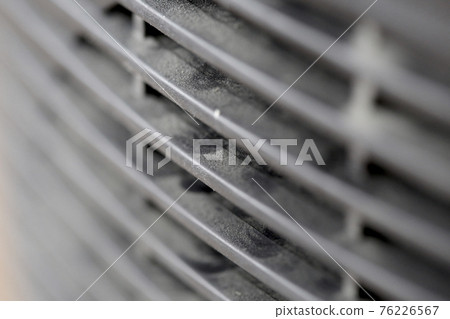 Dusty car radiator grill pattern background in black and white Dusty car radiator grill pattern background in black and white 76226567