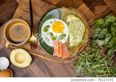Eggs with fish and avocado for breakfast Eggs with fish and avocado for breakfast 76227245