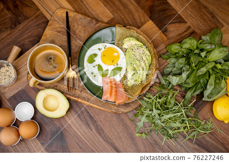 Eggs with fish and avocado for breakfast Eggs with fish and avocado for breakfast 76227246
