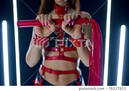 Sexy stripper with red leather whip, bdsm show Sexy stripper with red leather whip, bdsm show 76227853