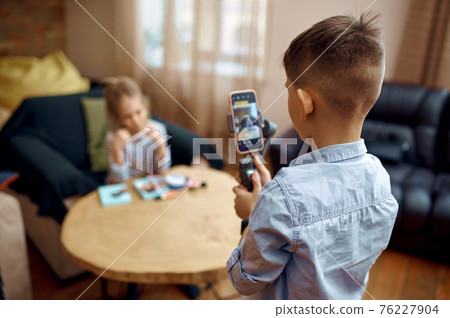 Two children bloggers records blog on camera 76227904