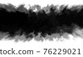 Ink stain slowly spreads over the paper. 76229021