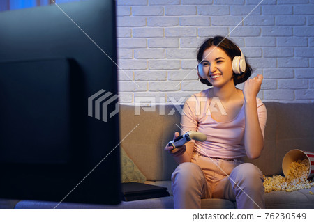 involved gamer girl playing video games on the console involved gamer girl playing video games on the console 76230549