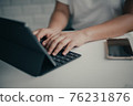 Female hands on keyboard ,Female freelance working business at home 76231876