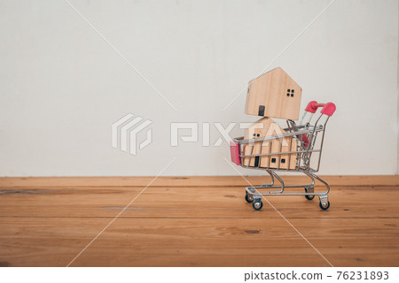 Home in Shopping cart , Buying and selling real estate, Home concept Home in Shopping cart , Buying and selling real estate, Home concept 76231893