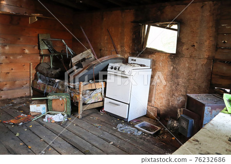 An abondoned trappers cabin in a state of disrepair An abondoned trappers cabin in a state of disrepair 76232686