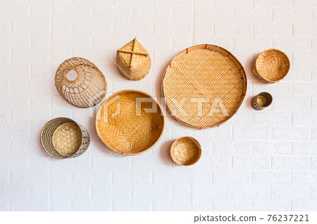 Group of bamboo wicker model (fishing traps) on wall. Group of bamboo wicker model (fishing traps) on wall. 76237221