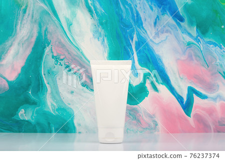 White cream tube on white table against marbled background with copy space.Concept of beauty products for skin care.  76237374