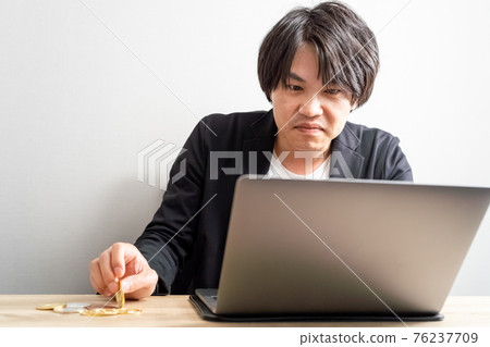 Cryptocurrency, a man watching the market Cryptocurrency, a man watching the market 76237709