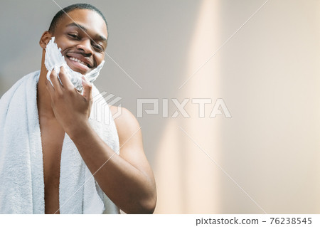 male skincare man applying shaving foam on face male skincare man applying shaving foam on face 76238545