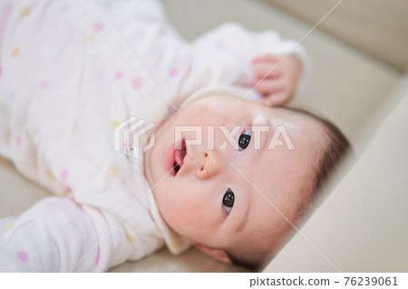 Asian baby girl looking at the camera 76239061