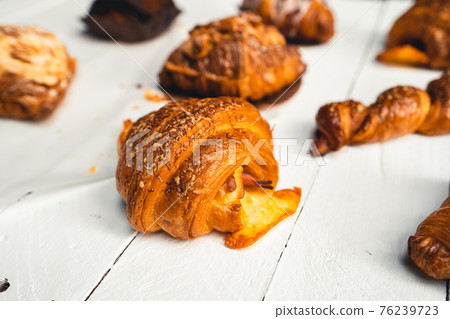 Freshly baked traditional bread on wooden table Freshly baked traditional bread on wooden table 76239723