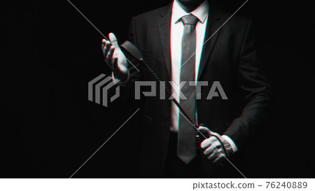 male dominant holds a leather whip Flogger for hard BDSM sex male dominant holds a leather whip Flogger for hard BDSM sex 76240889