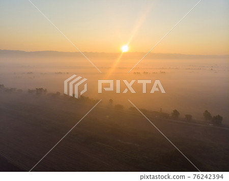 Morning sunrise misty on field silhouette nature countryside 76242394