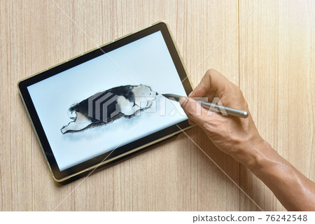 a tablet showing hand sketch the drawing of beagle dog with digital pens on wood table, the concept of new technology for drawing and rendering of tablet with digital pen 76242548