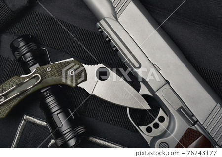 Semi-automatic handgun .45 pistol tactical flash light and pocket army knife. 76243177