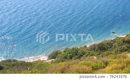 Beautiful view of the coast of the turquoise sea at Cape Fiolent, Crimea. The concept of tranquility 76243876