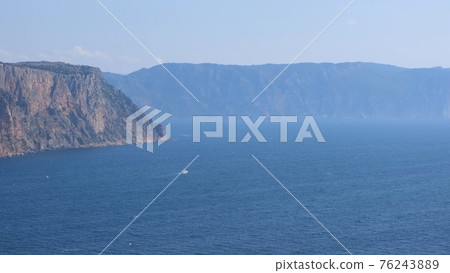 Beautiful view of the coast of the turquoise sea at Cape Fiolent, Crimea. The concept of tranquility Beautiful view of the coast of the turquoise sea at Cape Fiolent, Crimea. The concept of tranquility 76243889