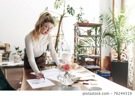 An interior designer is working on a new project An interior designer is working on a new project 76244319