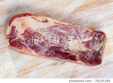 Piece of cured pork shoulder lacon curado Piece of cured pork shoulder lacon curado 76245360