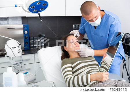 Woman having consultation with doctor in clinic Woman having consultation with doctor in clinic 76245635