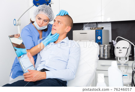 Man having consultation with doctor in clinic Man having consultation with doctor in clinic 76246057