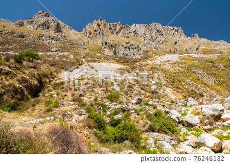 View of Rocca del Crasto near Alcara Li Fusi town in the Nebrodi Park, Sicily View of Rocca del Crasto near Alcara Li Fusi town in the Nebrodi Park, Sicily 76246182