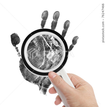 Magnifying glass and hand print 76247466