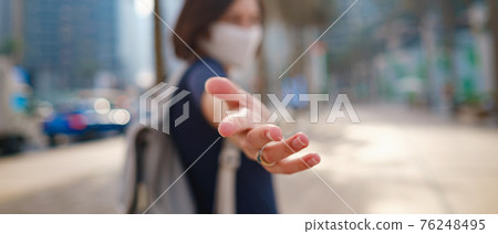 Portrait of young woman wearing in blue dress and white mask Portrait of young woman wearing in blue dress and white mask 76248495