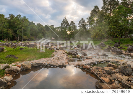 Natural hot spring mineral water with steam in Chae Son National Park in the morning, Lampang, Thailand. 76249649