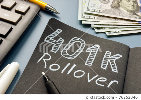 401k rollover memo on the notepad and cash. 76252340