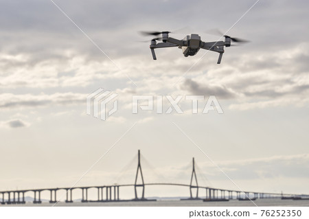 Quadcopter, drone, helicopter, unmanned aerial vehicle, unmanned plane, unmanned flying drone, Incheon Bridge, Songdo, Yeonsu-gu, Incheon Quadcopter, drone, helicopter, unmanned aerial vehicle, unmanned plane, unmanned flying drone, Incheon Bridge, Songdo, Yeonsu-gu, Incheon 76252350