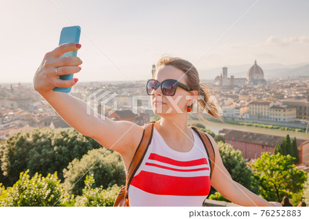 Tourist taking selfie with Florence cityscape Tuscany Italy Tourist taking selfie with Florence cityscape Tuscany Italy 76252883