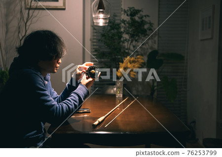 A man in his 40s who enjoys hobbies in the middle of the night A man in his 40s who enjoys hobbies in the middle of the night 76253799