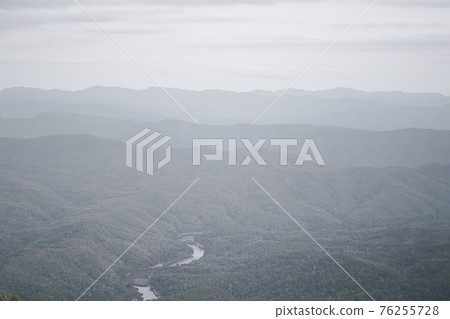 Panoramic landscape picture of fresh green rain forest and mountain background. Panoramic landscape picture of fresh green rain forest and mountain background. 76255728