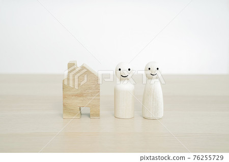 Happy family and New home concept. Family wooden peg doll on wood table. Happy family and New home concept. Family wooden peg doll on wood table. 76255729