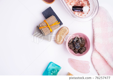 natural   spa set with salt, healing mud and soap on white  background. flay lay 76257477