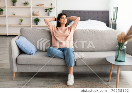 Woman having rest at home on the weekend 76258102