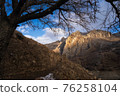 Lone tree grow at the edge of cliff. Force of life. Strong plant fighting for its future. Mountain landscape 76258104