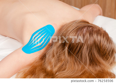 Kinesiotaping of shoulder with kinesiology tape Kinesiotaping of shoulder with kinesiology tape 76258506