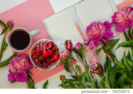 Still life with cup of coffee, sweet cherries and peony flowers on white background. Creative minimalism pink flat lay. 76258971