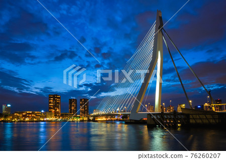View of Erasmus Bridge Erasmusbrug and Rotterdam skyline. Rotterdam, Netherlands View of Erasmus Bridge Erasmusbrug and Rotterdam skyline. Rotterdam, Netherlands 76260207