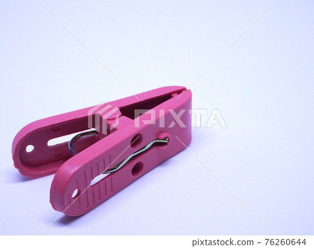 Red plastic clothespin isolated on white background  76260644
