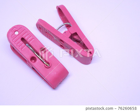 Red plastic clothespin isolated on white background Red plastic clothespin isolated on white background 76260658